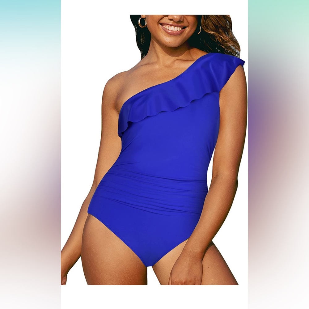 One shoulder swim suit. Beautiful blue color! Worn once. Size 12
